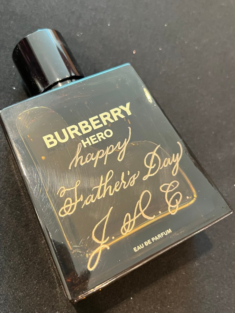 Burberry Hero cologne bottle engraved with “Happy Father’s Day JAC” in gold, personalized live by Wofford Calligraphy during the 2025 Gucci Father’s Day in-store event.