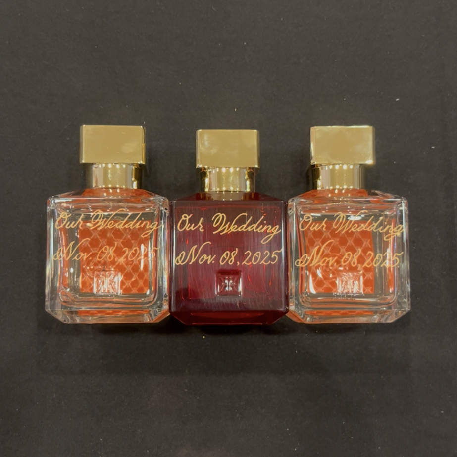 Alternate view of three Maison Francis Kurkdjian perfume bottles engraved in gold calligraphy with Our Wedding Nov 08, 2025, created as a personalized bridal gift at the Nordstrom Houston Galleria engraving event.