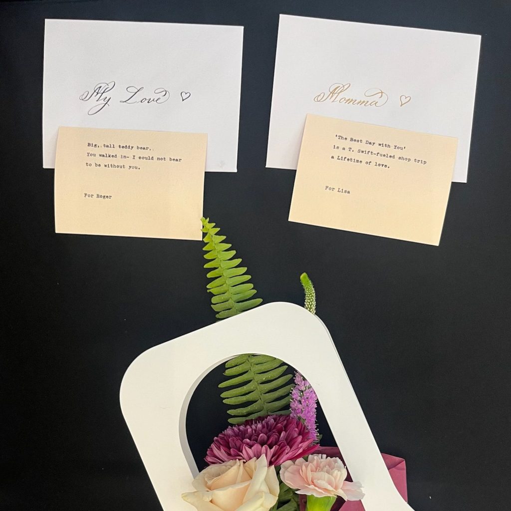 Houston live calligraphy envelopes with dip pen names paired with custom typed haiku poems and floral bouquet during a corporate Valentine’s Day activation.
