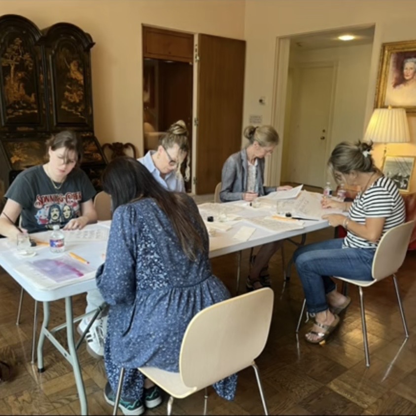 Adult students practicing calligraphy during a beginner calligraphy class at the MFAH Rienzi in Houston