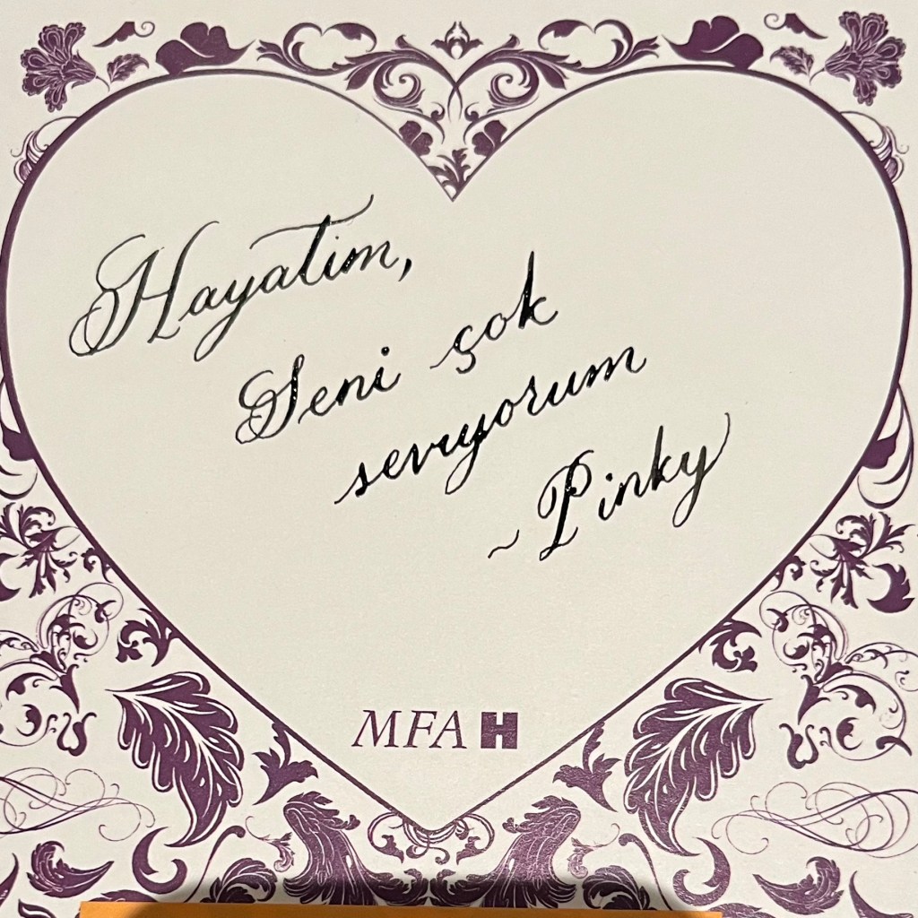 Handwritten dip pen calligraphy love note in Turkish on heart shaped paper created at the MFAH Rienzi Valentine’s Twilight Evening