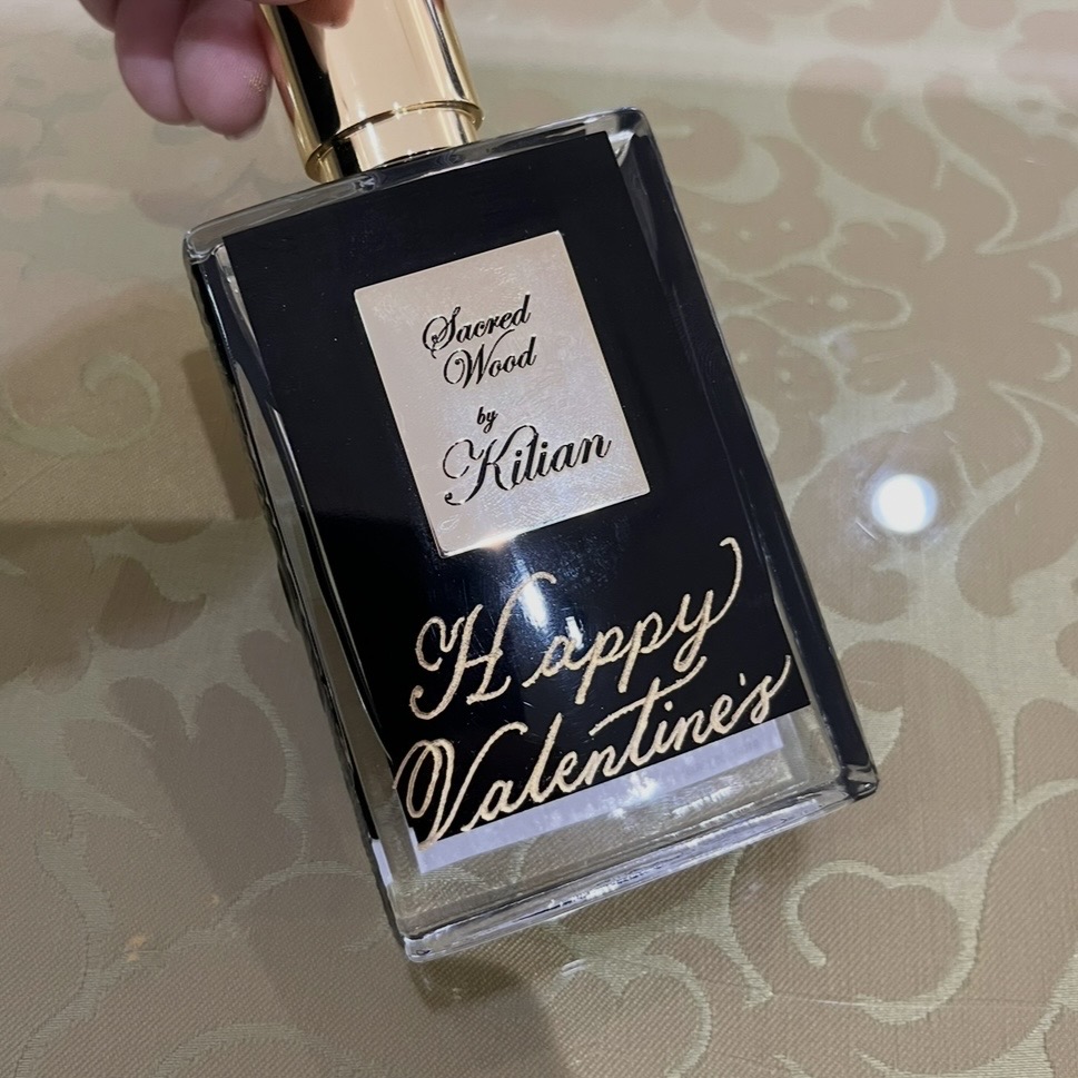 Kilian Paris Sacred Wood fragrance bottle engraved with “Happy Valentine’s” in gold-filled calligraphy as a custom Valentine’s Day gift for men.
