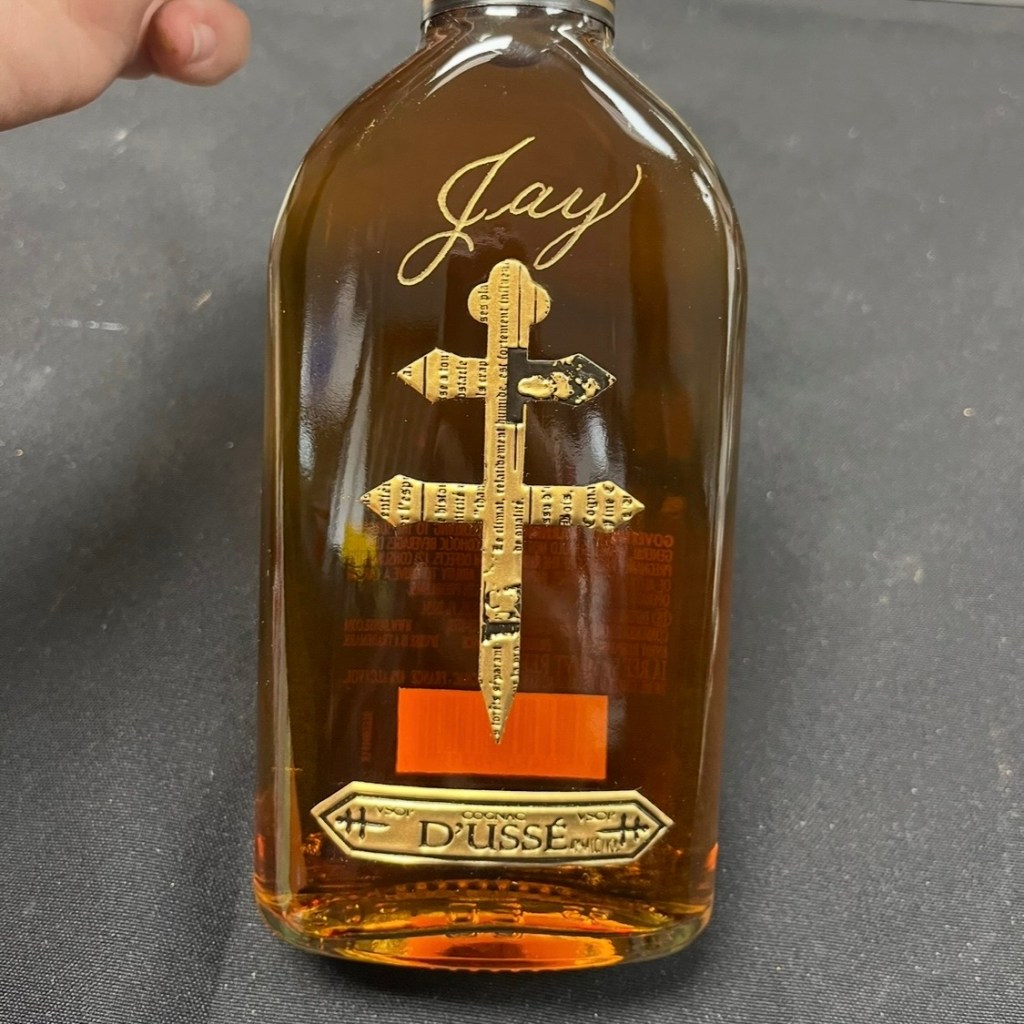 D’USSÉ cognac bottle engraved with the name “Jay” in gold-filled calligraphy, showcasing a personalized Valentine’s Day gift for him.
