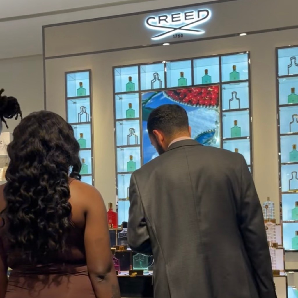 Houston live engraving event at Creed fragrance counter with guests watching bottle personalization at The Woodlands Mall