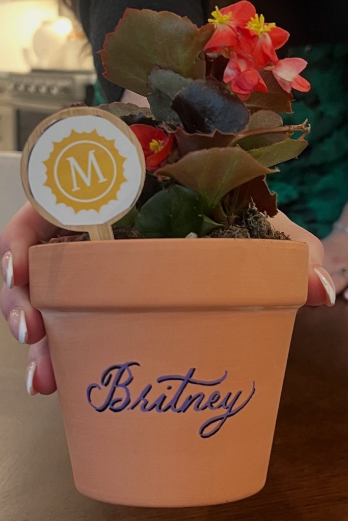 Personalized terra cotta pot with calligraphy name created at Houston Earth Day event for custom gift and event favor