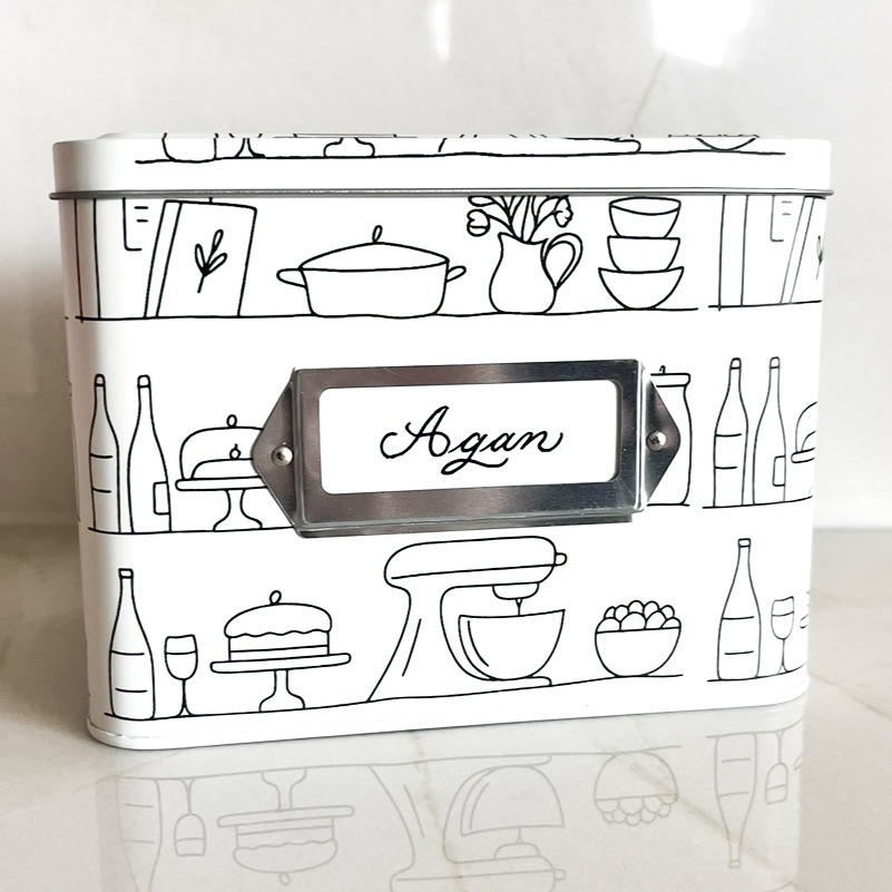 Personalized recipe card box with family name in calligraphy, illustrating meaningful handcrafted keepsakes